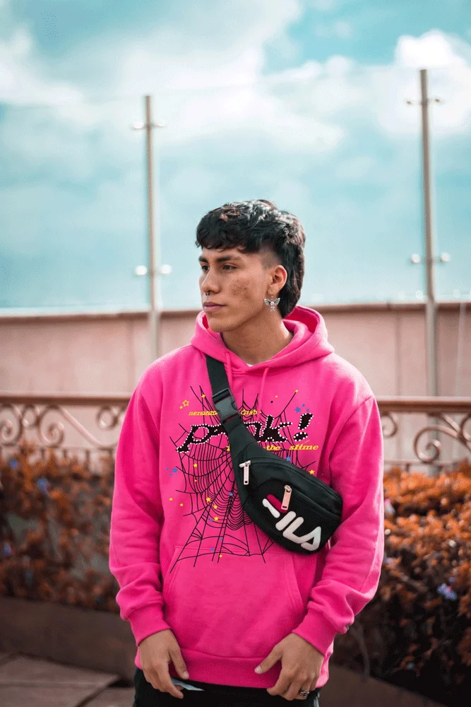 SP5DER pink hoodie worn on the streets